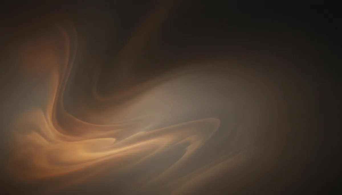 A muted mesh gradient bleeds warm charcoal and taupe across most of the frame, with a soft, heavily greyed amber and rust glow pooling in the lower-left, the two fields melting into each other under a layer of heavy analogue film grain.